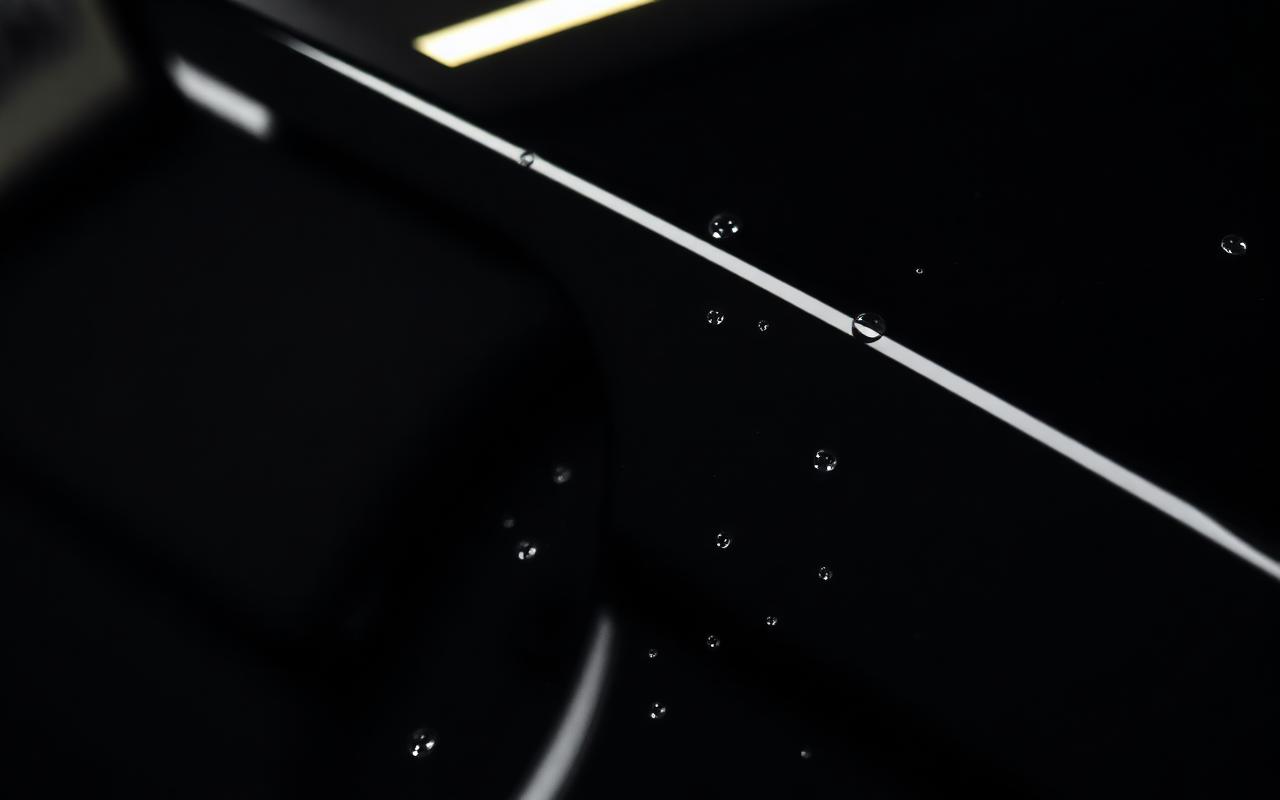 Car paint after paint correction and ceramic coating, showing mirror gloss